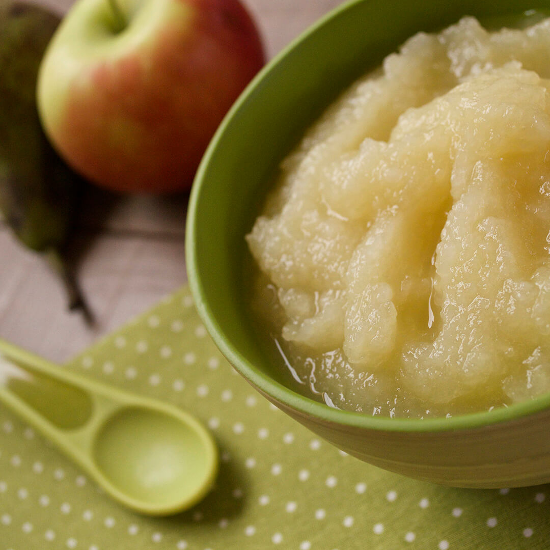 Simple Apple & Pear Puree in a bowl with a whole apple and pear next to it