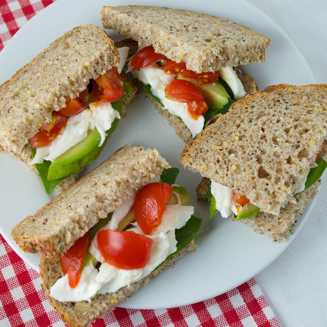 Tomato, Avocado & Mozzarella Sandwich cut into squares