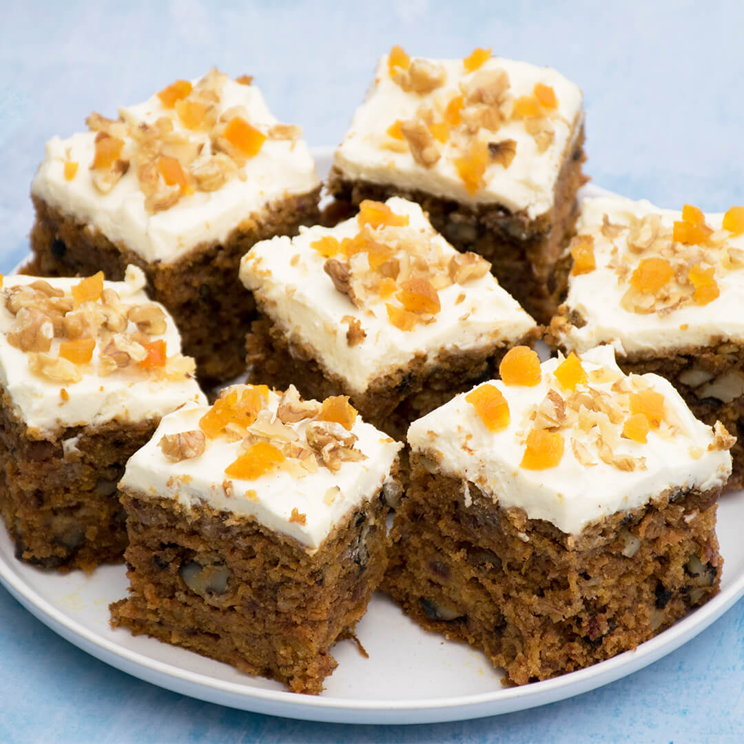 7 carrot cake squares on a plate