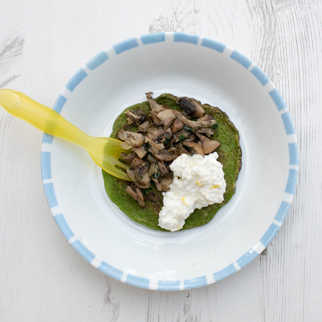 Spinach and mushroom pancakes served with ricotta and lemon