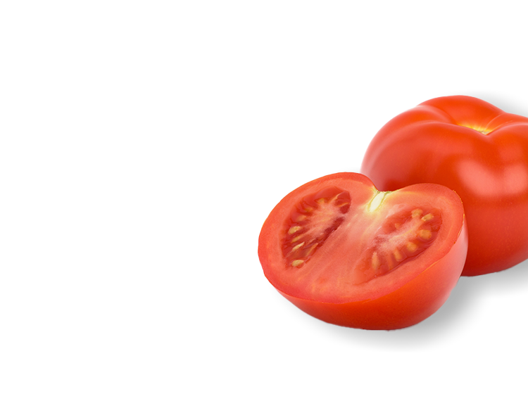 Halved tomato next to a whole tomato