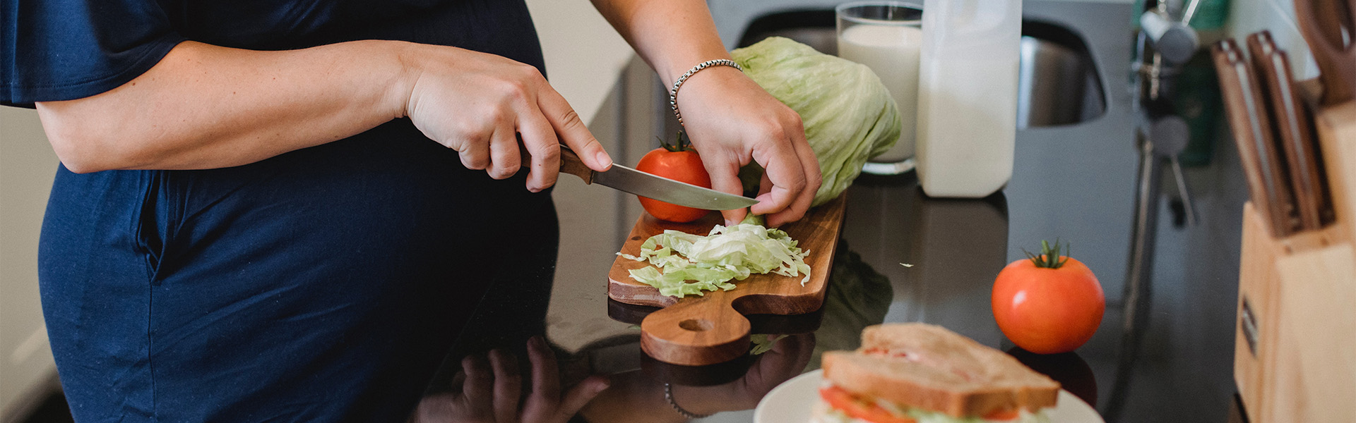 A pregnant woman preparing food