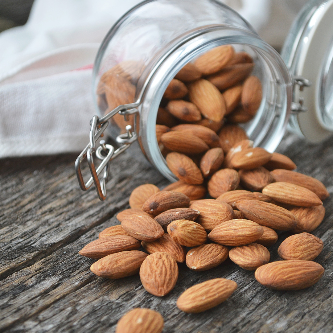 Some almonds in a glass jar