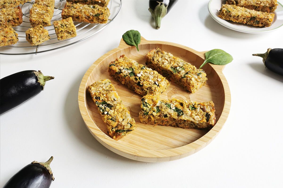 Aubergine flapjacks on plates and a serving dish