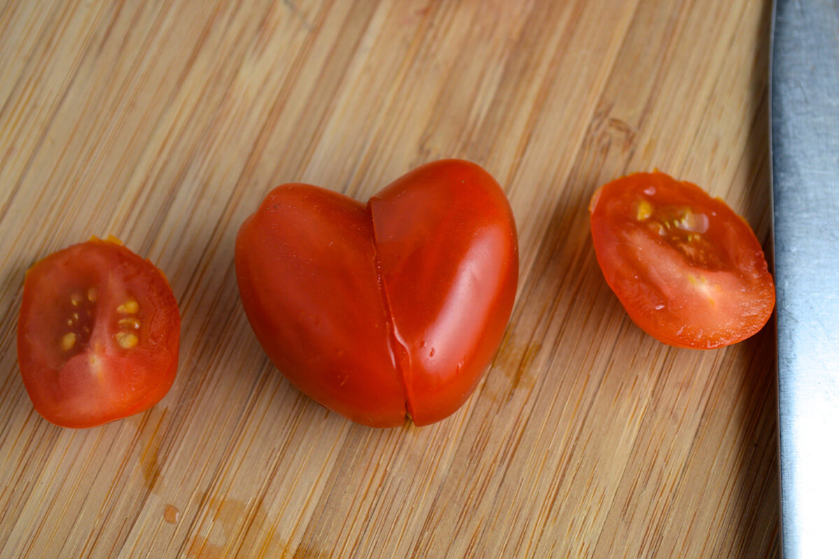 2 tomatoes cut and put together to create a heart shape