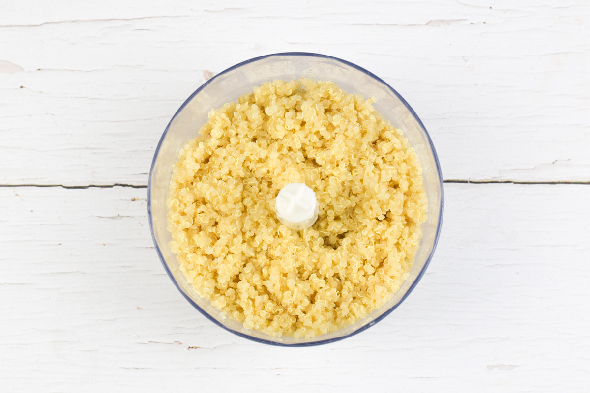 A food processor with cooked quinoa