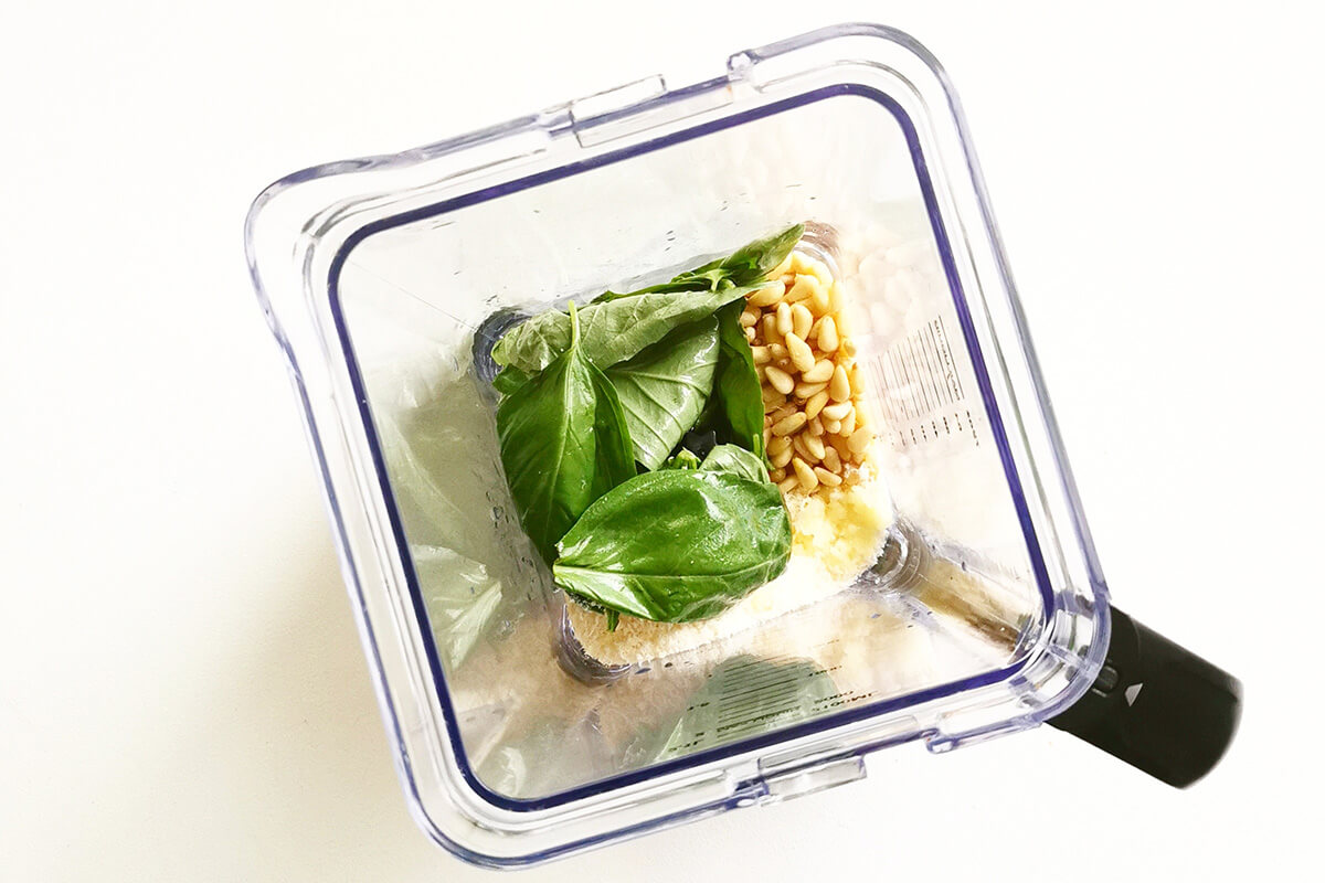Basil, minced garlic, pine nuts and parmesan in a blender