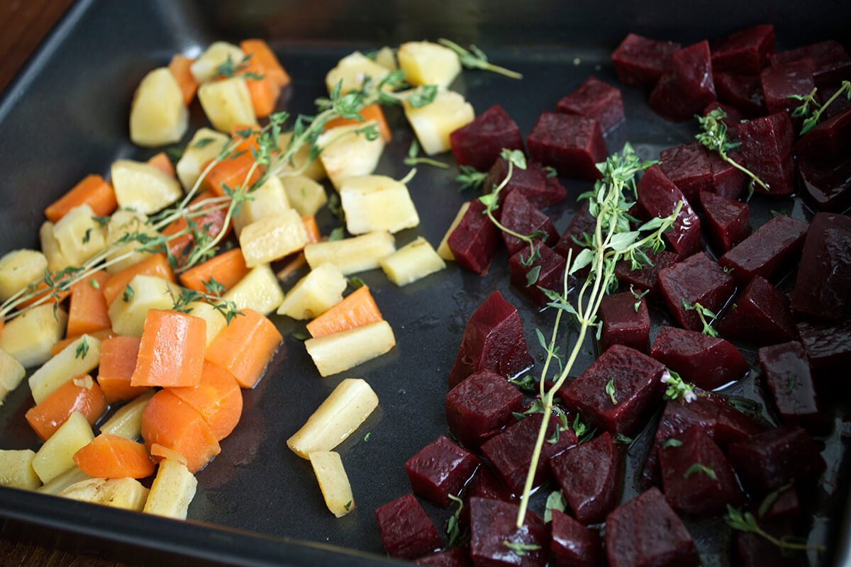 Beetroot, carrot, parsnip and thyme on a roasting tray