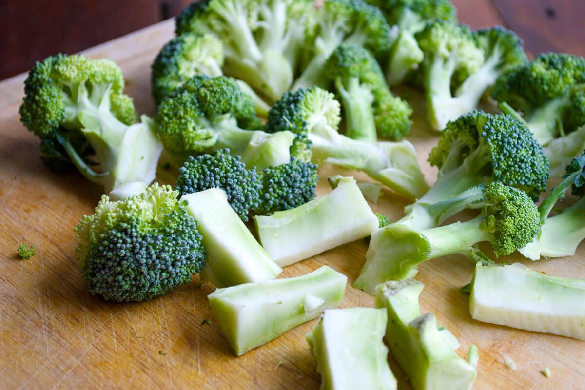 Cut broccoli florets on a chopping board