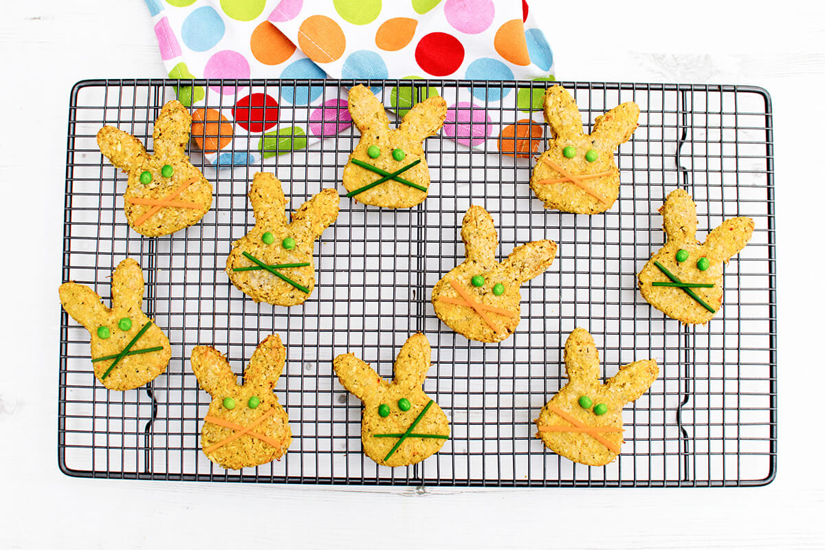 Bunny shaped Carrot, Cheese & Oat Biscuits with peas for eyes and carrot shavings or chives for whiskers