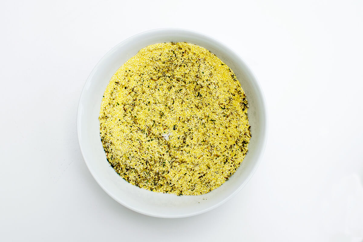 A bowl of polenta and dry herbs