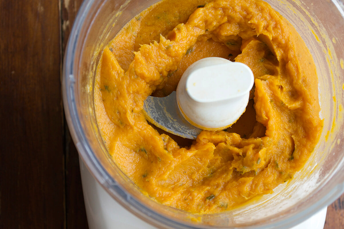 Blended sweet potato and leek puree in a blender
