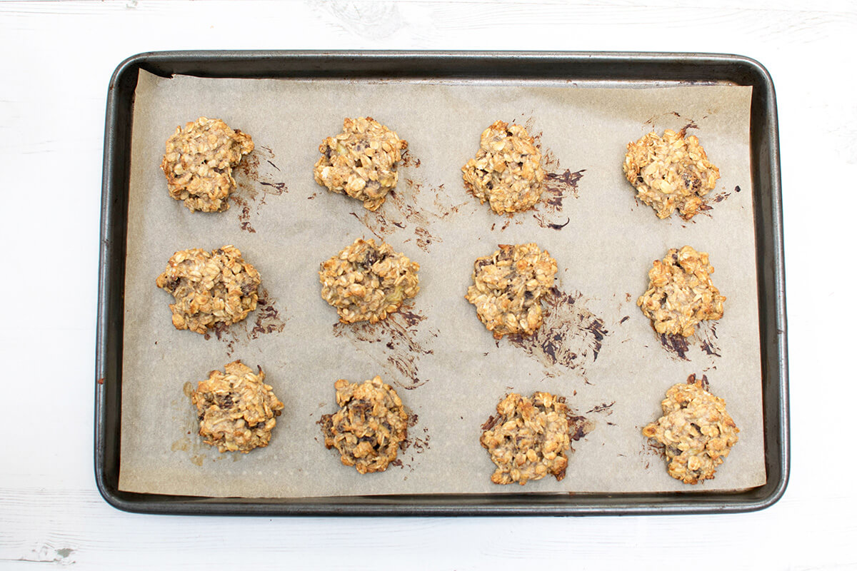 12 cooked Peanut Butter Gummy Cookies on a baking tray lined with parchment paper