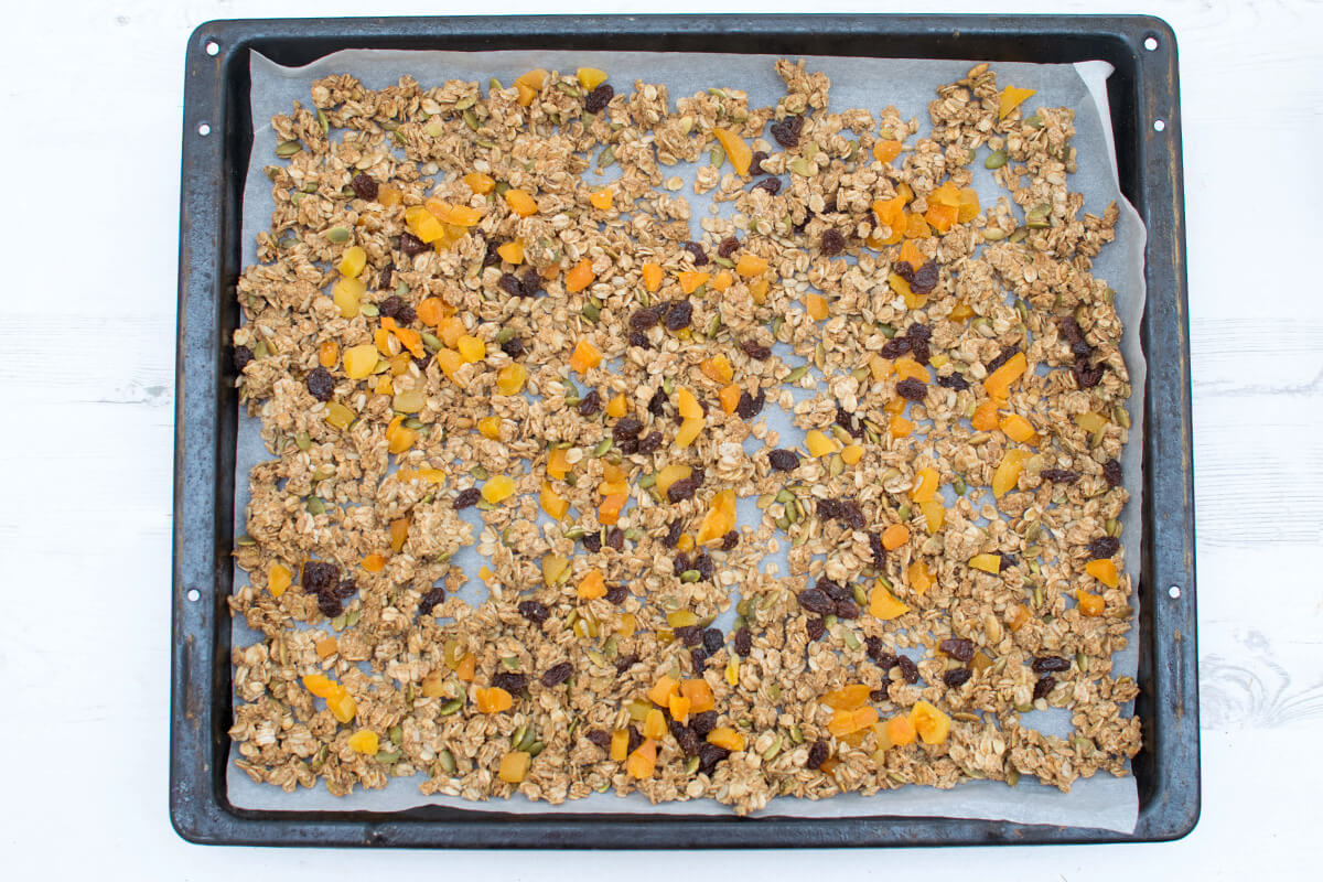 Spiced Apricot Granola on a baking tray lined with baking sheet