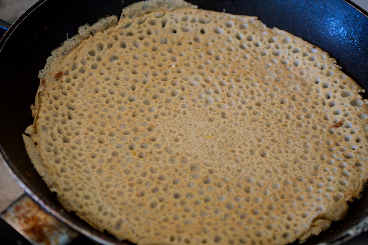 Pancake being cooked in frying pan